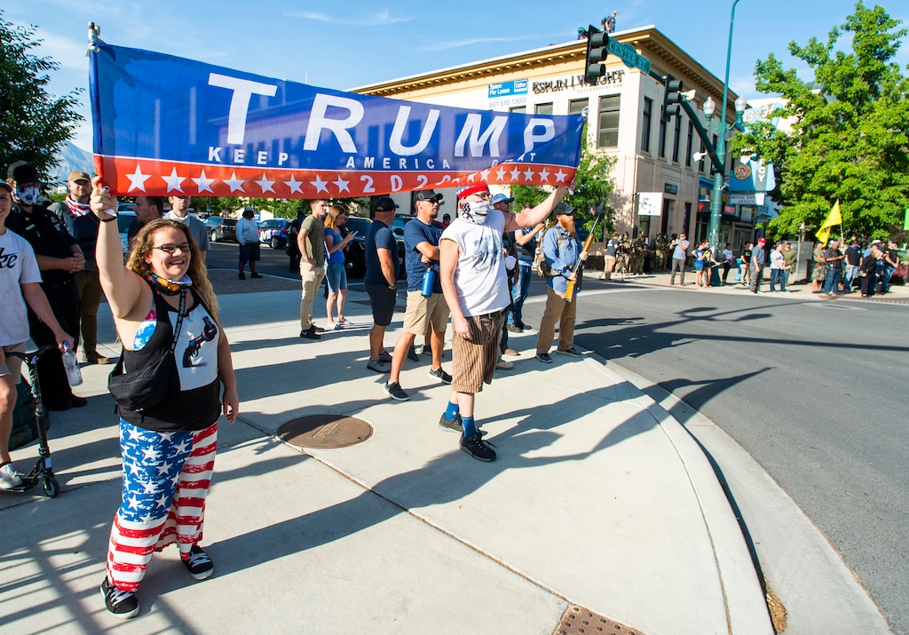 (Rick Egan  |  The Salt Lake Tribune)   a couple of dozen counter protesters wave a Trump banner as  Black Lives Matter protesters chant across the street, on Center Street in Provo, Wednesday July 1, 2020.