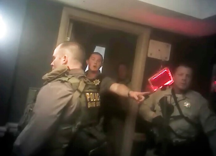 This photo from police officer video body camera footage on Oct. 1, 2017, provided by the Las Vegas Metropolitan Police Department, shows officers as they breach the shooter's room during the deadliest mass shooting in modern U.S. history by Stephen Paddock, at the Mandalay Bay Hotel in Las Vegas, released Wednesday, May 2, 2018. (Las Vegas Metropolitan Police Department via AP)