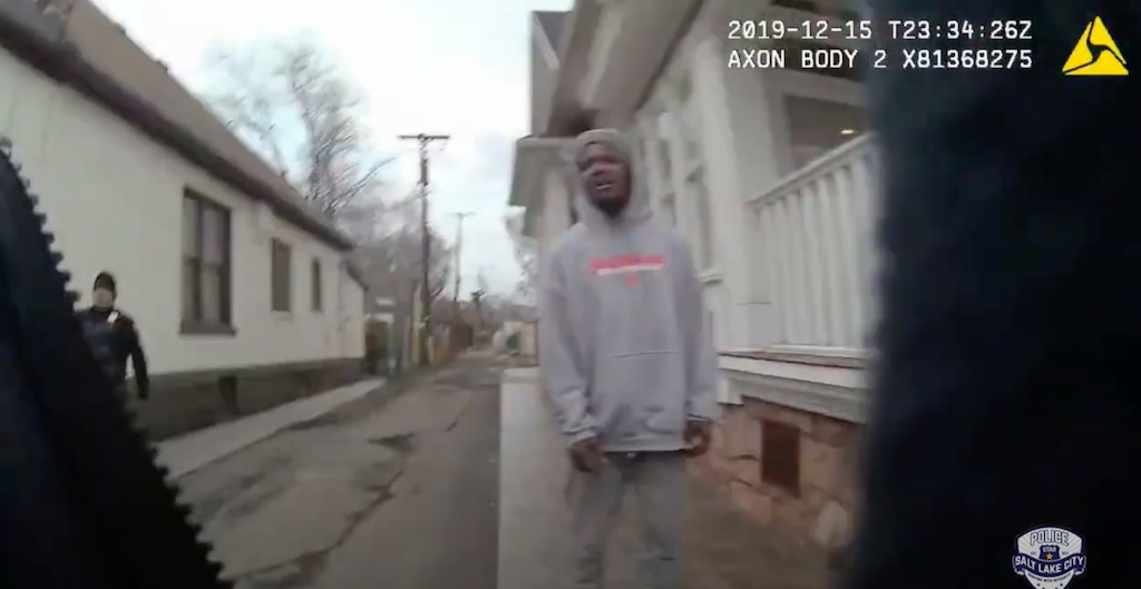 (Salt Lake City Police Department) In this screenshot of police body camera footage, Tarik Mason stands in an alley seconds before he is tackled to the ground by Salt Lake City police on Dec. 15, 2019. An officer had stopped Mason for jaywalking, police said, and Mason ran from the officer, who then called for backup before the arrest.
