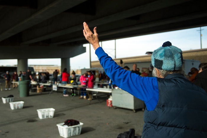 (Chris Detrick | The Salt Lake Tribune) Eagles Ranch Ministries founder Jennie Dudley prays before serving Thanksgiving Day meals during the Eagle Ranch Chuckwagon under the viaduct at 500 South and 600 West in Salt Lake City Thursday, November 23, 2017.