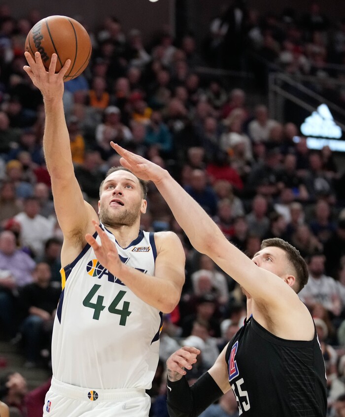 (Francisco Kjolseth | The Salt Lake Tribune) Utah Jazz forward Bojan Bogdanovic (44) gets past LA Clippers center Isaiah Hartenstein (55) in NBA action between the Utah Jazz and the LA Clippers at Vivint Smart Home Arena in Salt Lake City, Wednesday, Dec. 15, 2021.