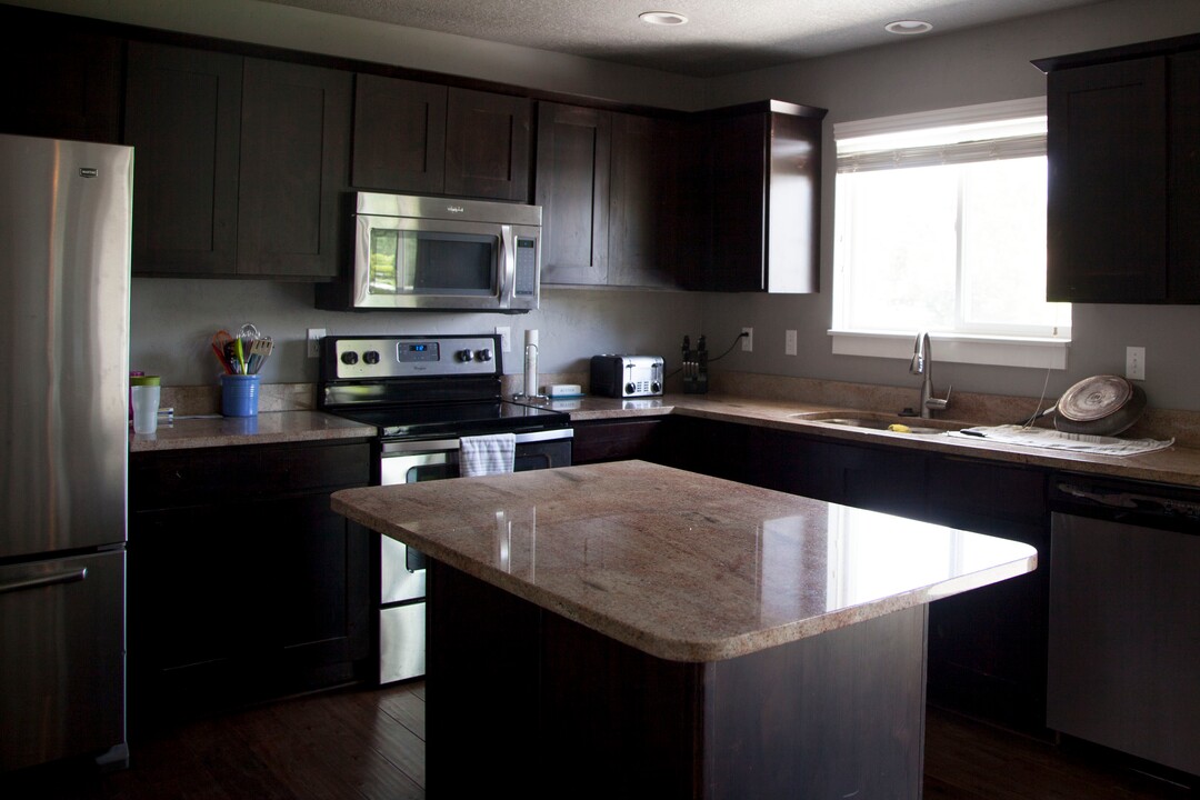 (Stella Yu |  The Salt Lake Tribune) The 2,713-square-foot rambler home in South Jordan includes five bedrooms, three and a half baths, two family rooms, a fireplace, a kitchen, a bar and a semi-formal dining room. A two-car garage is attached to the house with outdoor RV parking space.