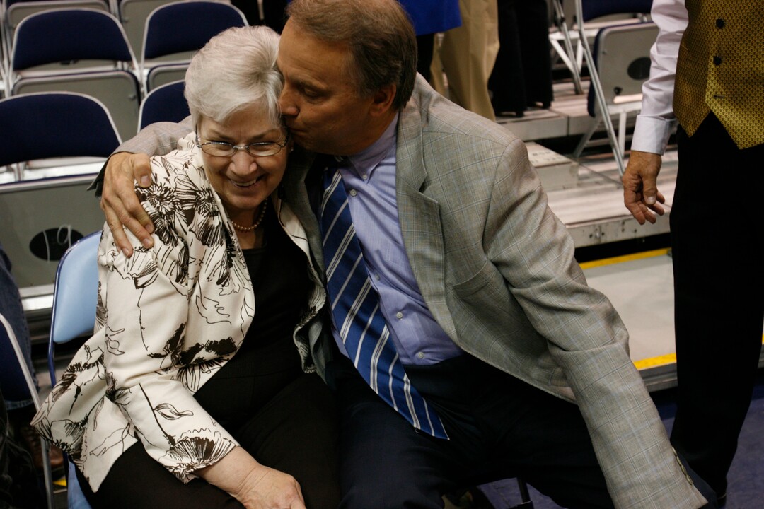 (Trent Nelson  |  Tribune file photo) Gail Miller gets a kiss from Utah Jazz/LHM Sports and Entertainment president Randy Rigby prior to a pregame tribute to her husband Larry H. Miller at a Jazz game against New Orleans Saturday February 21, 2009. Larry H. Miller died the day before.
