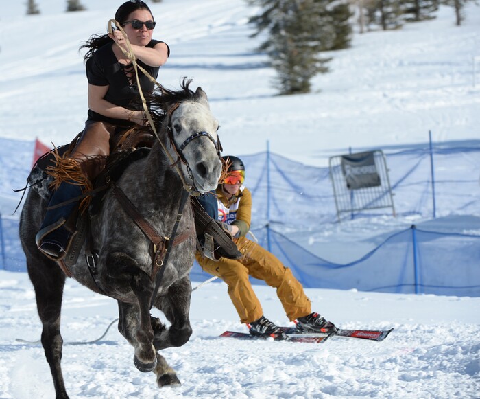(Rick Egan | The Salt Lake Tribune) Ashley pulls Dylan the skier, for team "Riding in Style", in the Skijoring competition at Soldier Hollow Friday. Feb. 22, 2019.