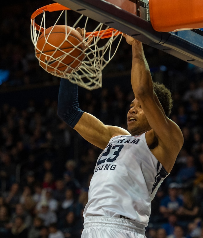 (Rick Egan  |  The Salt Lake Tribune)      Brigham Young forward Yoeli Childs (23) dunks the ball for the Cougars, in basketball action between Brigham Young Cougars and Santa Clara Broncos at the Marriott Center in Provo, Saturday, Jan. 12, 2019.


