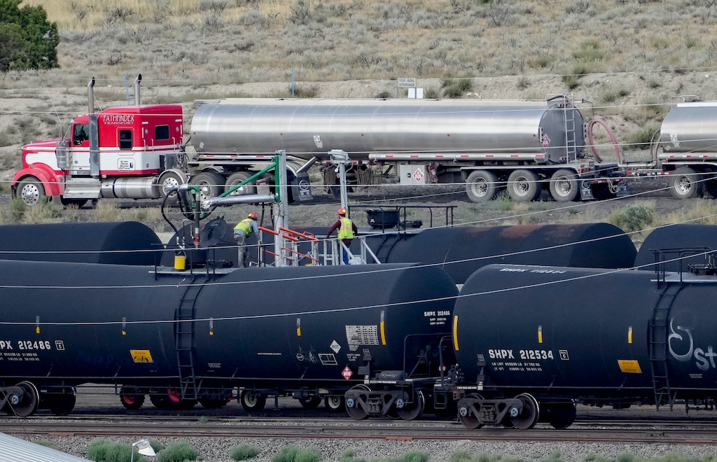 (Francisco Kjolseth | The Salt Lake Tribune) Crude oil is transferred from tanker trucks to rail cars parked at the Wildcat Loadout near Helper. The old coal-handling facility has been repurposed for transloading oil that is trucked from the Uinta Basin and shipped by rail to Gulf Coast refineries. Similar facilities along with an 85-mile rail spur are under development in the basin.