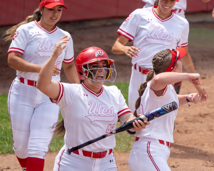 (Rick Egan | The Salt Lake Tribune)  Julia Jimenez celebrates a Utah Home run by Ellessa Bonstrom, in NCAA Softball Super Regionals action between the Utah Utes and the San Diego State Aztecs, on Saturday, May 27, 2023.
