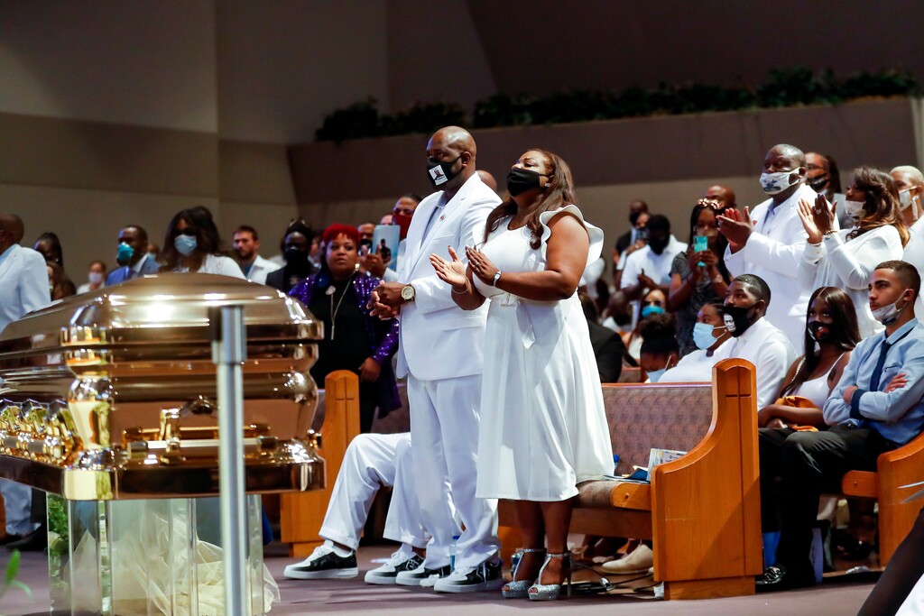 Family members stand up and react as the Rev. Al Sharpton gives the eulogy during the funeral for George Floyd at The Fountain of Praise church in Houston on Tuesday, June 9, 2020. Floyd died after being restrained by Minneapolis Police officers on May 25. (Godofredo A. Vasquez/Pool via The New York Times)