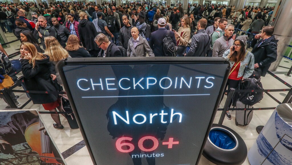 Security lines at Hartsfield-Jackson International Airport in Atlanta stretch more than an hour long amid the partial federal shutdown, causing some travelers to miss flights, Monday morning, Jan. 14, 2019. The long lines signaled staffing shortages at security checkpoints, as TSA officers have been working without pay since the federal shutdown began Dec. 22. (John Spink/Atlanta Journal-Constitution via AP)