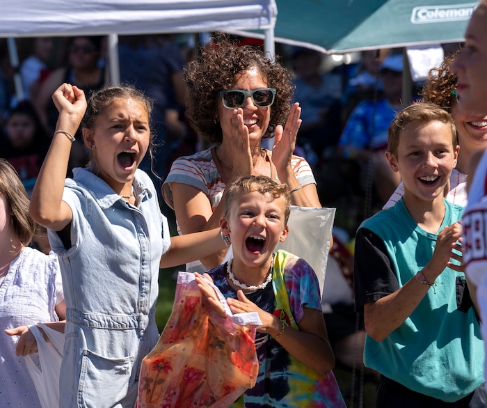 (Rick Egan | The Salt Lake Tribune)  Parade goers cheer on the Weber High cheer leaders, in the Cherry Days Fourth of July parade, in North Ogden, on Monday, July 4, 2022.