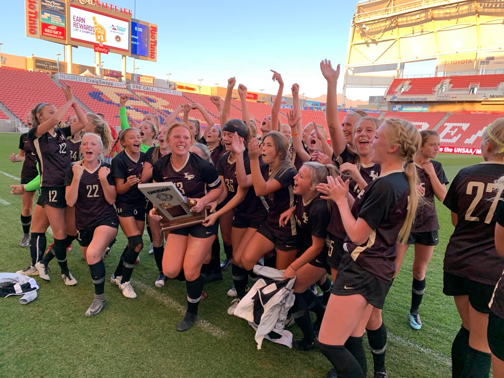 Lone Peak High celebrates after winning the Class 6A girls state championship Friday, Oct. 19, 2018, in Sandy. (Alex Vejar | The Salt Lake Tribune)