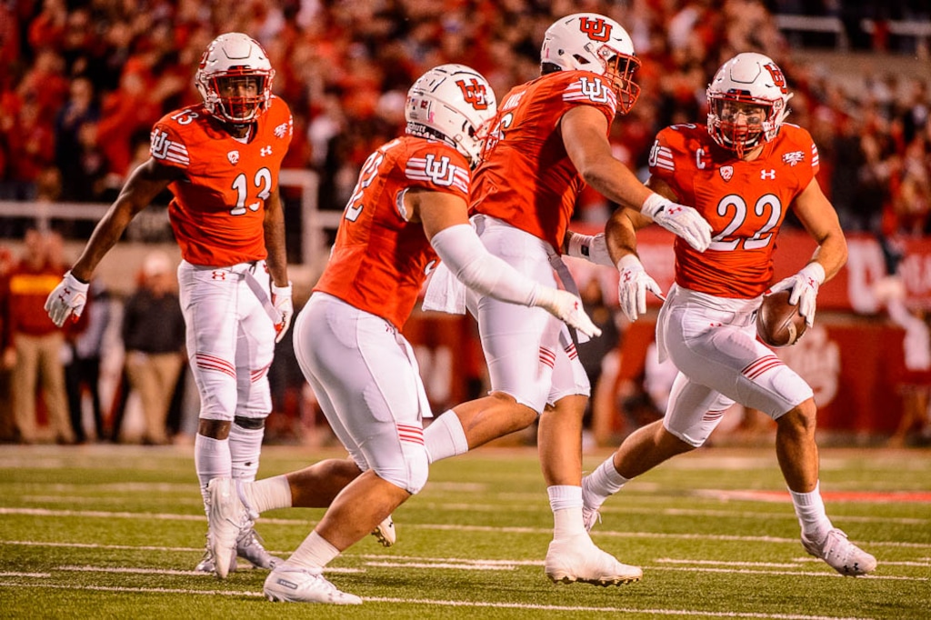 (Trent Nelson | The Salt Lake Tribune)  Utah Utes linebacker Chase Hansen (22) and teammates celebrate a first half interception as the Utah Utes host the USC Trojans, NCAA football at Rice-Eccles Stadium in Salt Lake City, Saturday Oct. 20, 2018.