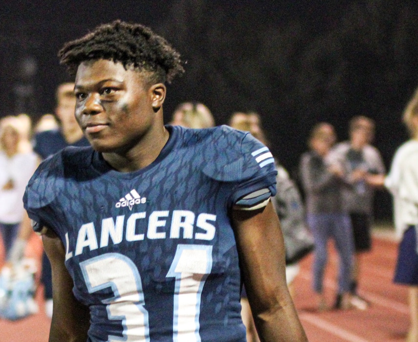 (Craig Hammond) Pictured is Elias West, playing football for Layton High School.