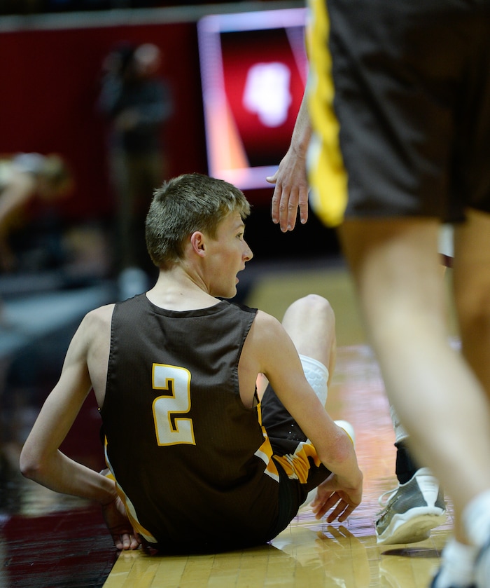 (Francisco Kjolseth  |  The Salt Lake Tribune)  Davis vs Lone Peak, 6A State high school basketball tournament at the Huntsman Center in Salt Lake City, Thursday March 1, 2018. Trevan Leonhardt (2) ends up on the floor against Lone Peak. 