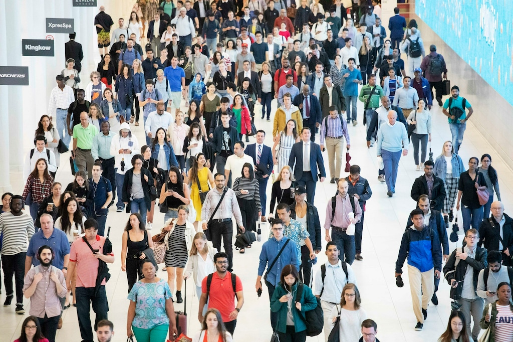 (Mark Lennihan, AP) In this June 21, 2019, file photo commuters walk through a corridor in the World Trade Center Transportation Hub in New York. Employee burnout is a growing problem in the nation's workforce.
