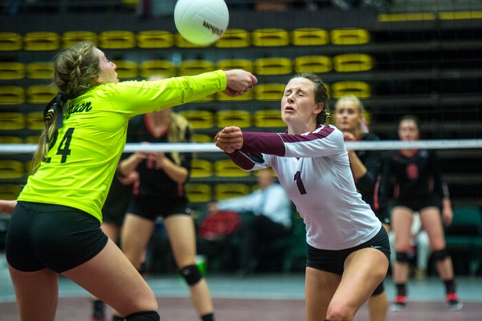 (Chris Detrick  |  The Salt Lake Tribune)  Morgan's Hannah Farr (24) and Morgan's Ellee Anderson (1) go for the ball during the the 3A volleyball state championships at the UCCU Center at Utah Valley University Thursday, October 26, 2017.  Morgan defeated North Sanpete 3-0.