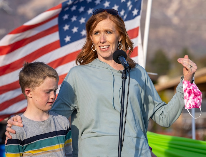 (Rick Egan | The Salt Lake Tribune)  Jennie Taylor stands with her son Jacob as she says a few words, during the Earth Day Party at the Mini Taylor farm at at the Jennie Taylor's residence, in North Ogden. Taylor is the widow to the late Major. Brent Taylor, killed in 2018 while on Army National Guard duty in Afghanistan, donations have helped restore the small family farm, with planter boxes, a chicken coop, and a sandbox for the kids, on Thursday, April 22, 2021.