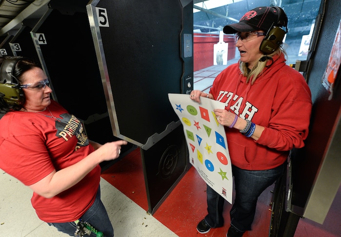 (Francisco Kjolseth  |  The Salt Lake Tribune)  Melanie Lewis, left, and Connie Peterson, both members of The Well-Armed Woman, gather at The Gun Vault shooting range in South Jordan during a monthly training.