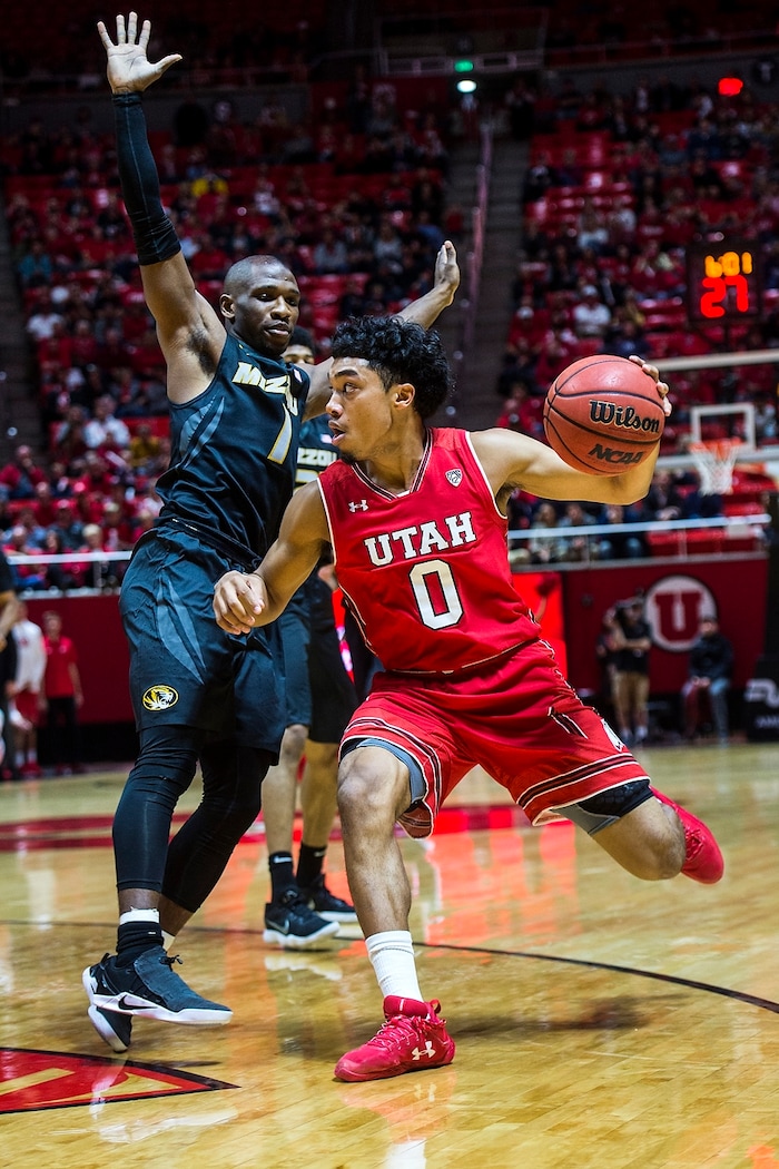 (Chris Detrick  |  The Salt Lake Tribune)  Utah Utes guard Sedrick Barefield (0) runs past Missouri Tigers guard Terrence Phillips (1) during the game at the Jon M. Huntsman Center Thursday, November 16, 2017.   
