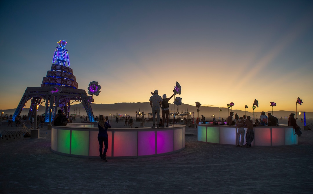 (Rick Egan  |  The Salt Lake Tribune)   The man glows as the sunsets, for the last time, before he is burned, at Burning Man, in the Black Rock Desert, near Gerlach, Nevada. The Art Theme this year is Metamorphoses. Friday, Aug. 30, 2019.