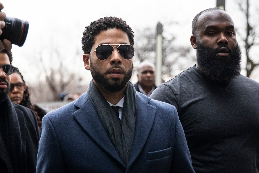 (Ashlee Rezin | Chicago Sun-Times via AP) Empire actor Jussie Smollett, center, arrives at the Leighton Criminal Court Building for his hearing on Thursday, March 14, 2019, in Chicago. Smollett is accused of lying to police about being the victim of a racist and homophobic attack by two men on Jan. 29 in downtown Chicago.