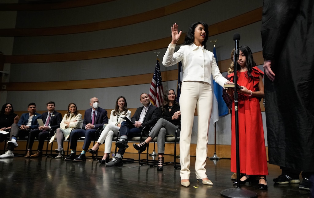 (Francisco Kjolseth | The Salt Lake Tribune) Eva Lopez Chavez is joined by her sister Galilea Lopez as she is sworn in as the City Council's District 4 representative by Salt Lake City Justice Court Judge Clemens Landau at the Salt Lake City Library on Tuesday, Jan. 2, 2024.