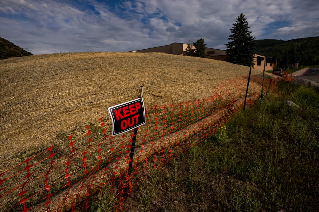 (Rick Egan | The Salt Lake Tribune) Contaminated soil piles sit behind Treasure Mountain Junior High in Park City on Aug. 24, 2023.