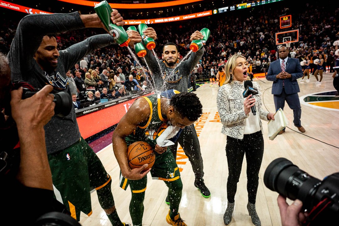 (Trent Nelson | The Salt Lake Tribune)  Utah Jazz guard Donovan Mitchell (45), drenched on the court during a post-game interview as the Utah Jazz host the Milwaukee Bucks, NBA basketball in Salt Lake City on Saturday March 2, 2019.