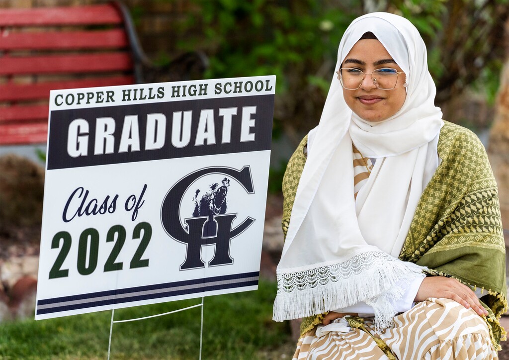 (Rick Egan | The Salt Lake Tribune)  Fatima Al-Saedy wears a keffiyeh (a traditional Arabic scarf) that she would like to wear at her Copper Hills graduation with her cap and gown to honor her family.