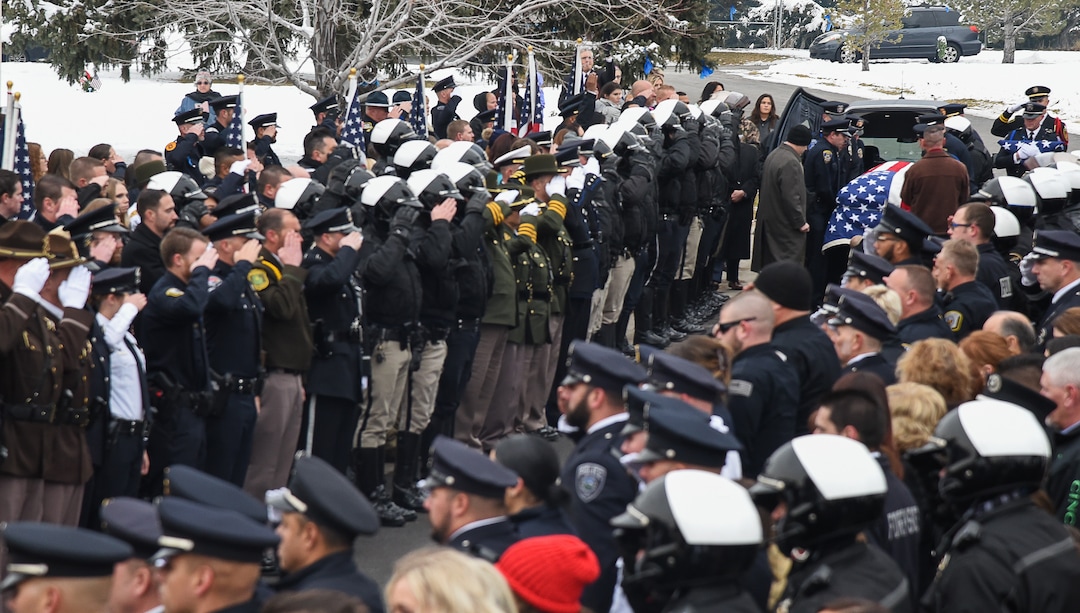 (Francisco Kjolseth  |  The Salt Lake Tribune)  Hundreds of Police officers attend funeral services for David Romrell at Larkin Sunset Gardens Cemetery in Sandy, Wed. Dec. 5, 2018.