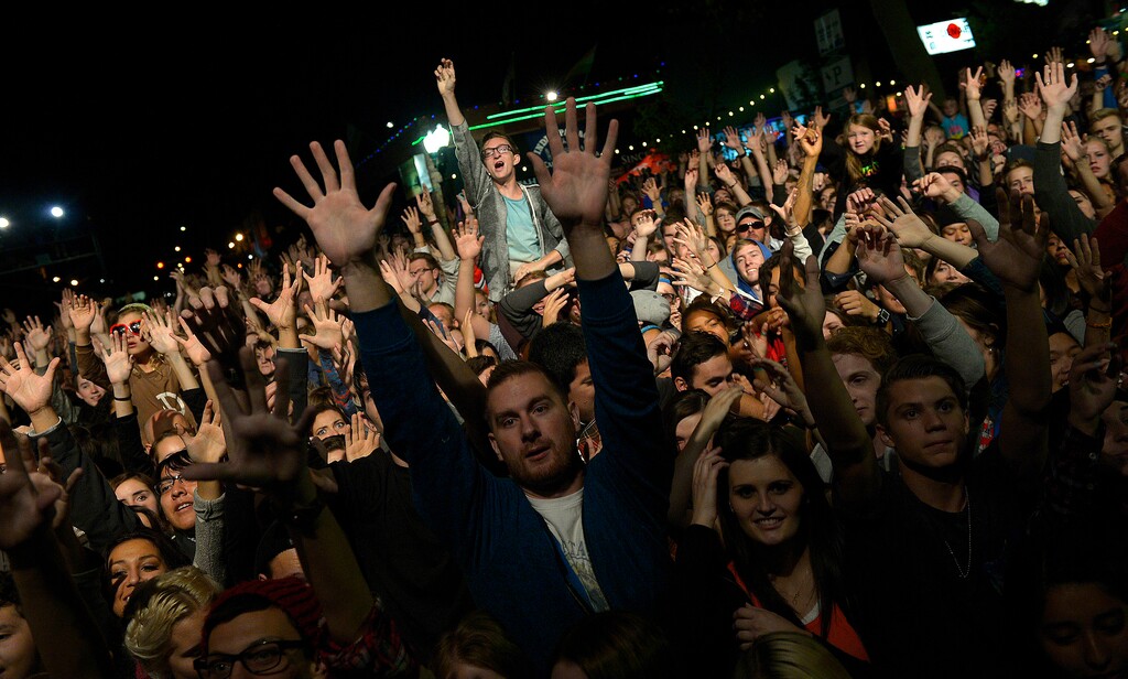 (Leah Hogsten | The Salt Lake Tribune) Neon Trees, Provo's best-known band, plays a free show Friday, Oct. 3, 2014, to a packed crowd in downtown Provo as part of the fifth annual Rooftop Concert Series. Neon Trees are drummer Elaine Bradley, guitarist Chris Allen, bassist Branden Campbell and lead singer Tyler Glenn.