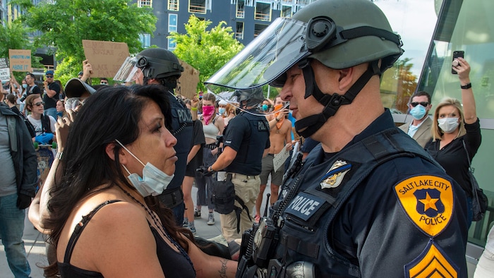 (Rick Egan  |  The Salt Lake Tribune) A protester hugs a Salt Lake City Police officer at the Public Safety Building, during a demonstration on Monday, June 1, 2020.