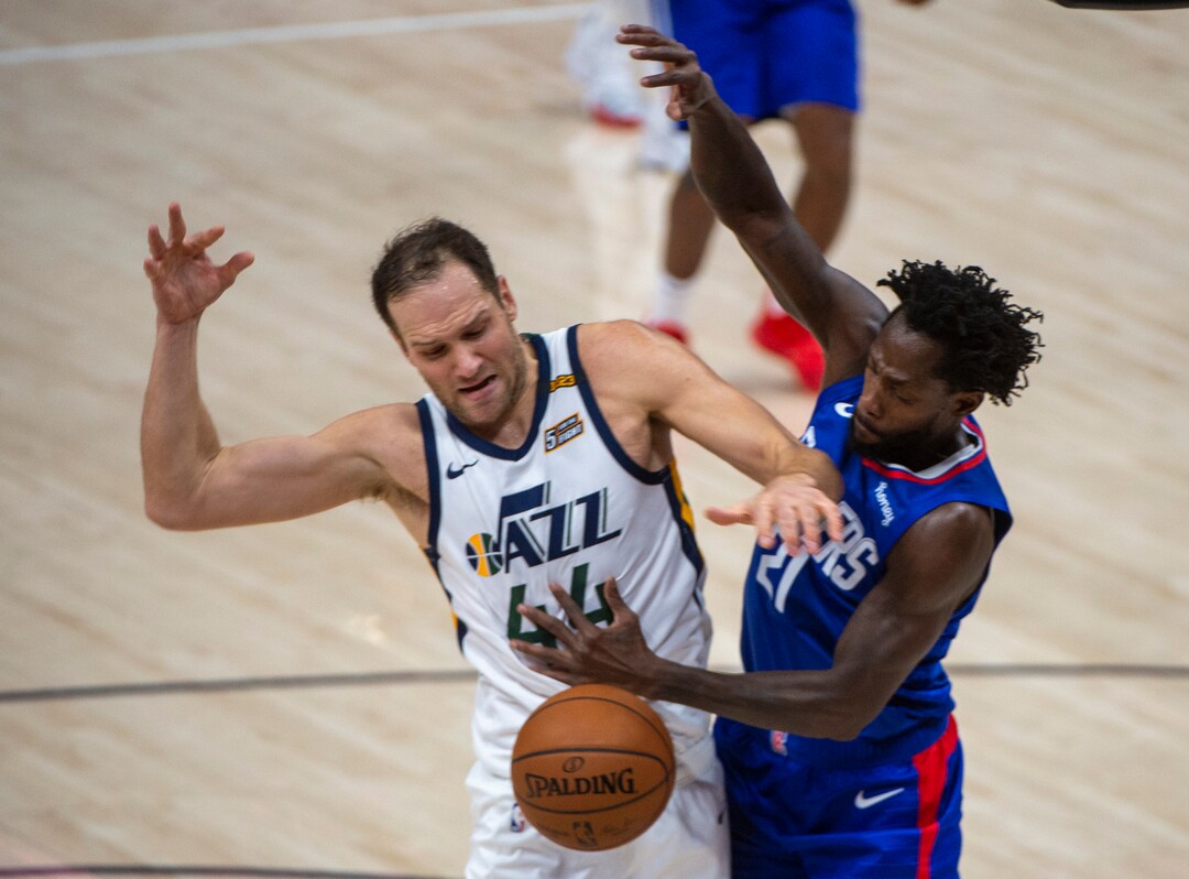 (Rick Egan | The Salt Lake Tribune) Utah Jazz forward Bojan Bogdanovic (44) collides with LA Clippers guard Patrick Beverley (21) as he goes to the hoop, in NBA action between the Utah Jazz and the LA Clippers at Vivint Arena, on Friday, Jan. 1, 2021.