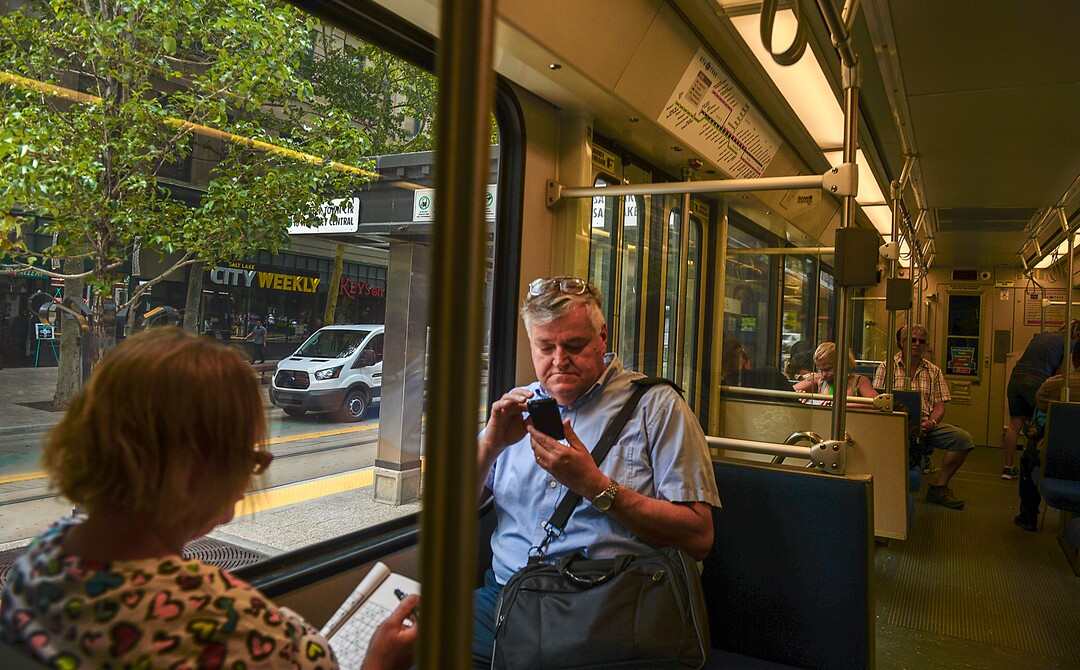 Leah Hogsten  |  The Salt Lake Tribune  Salt Lake Tribune reporter Lee Davidson rides Trax from the Salt Lake City Library to The Salt Lake Tribune building, Thursday, August 2, 2018.  · 