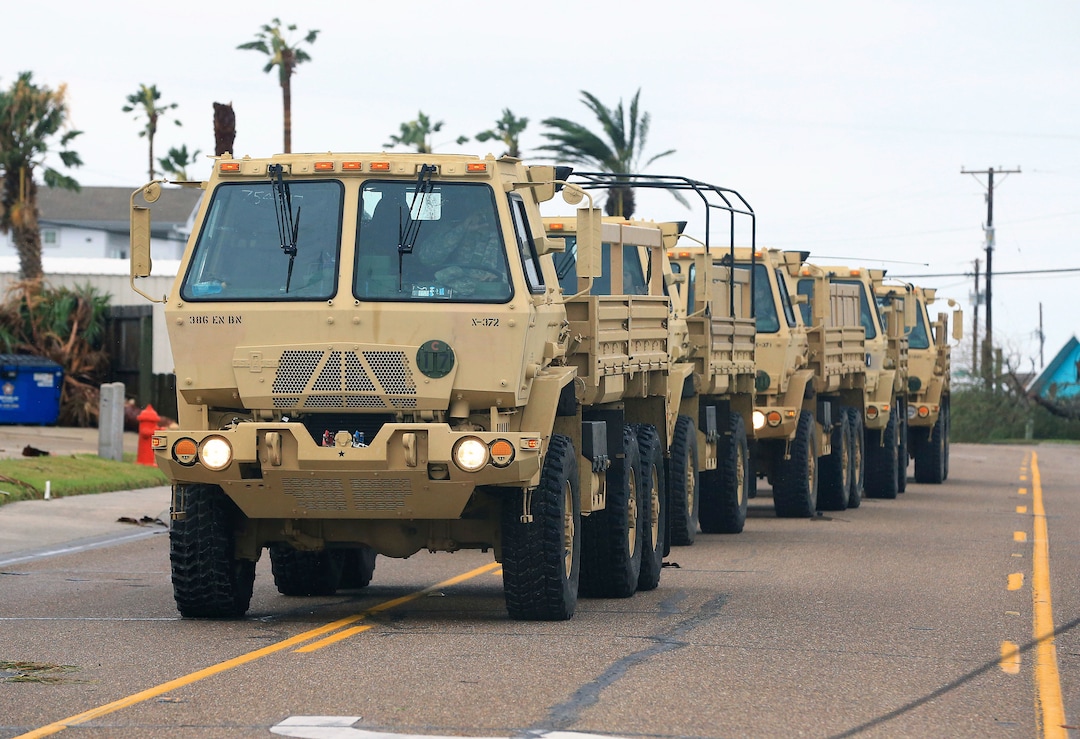(Gabe Hernandez | Corpus Christi Caller-Times via AP) Members of the National Guard arrive at Port Aransas after Hurricane Harvey landed in the Coast Bend area on Saturday, Aug. 26, 2017, in Port Aransas, Texas. The National Hurricane Center has downgraded Harvey from a Category 1 hurricane to a tropical storm. Harvey came ashore Friday along the Texas Gulf Coast as a Category 4 storm with 130 mph winds, the most powerful hurricane to hit the U.S. in more than a decade.