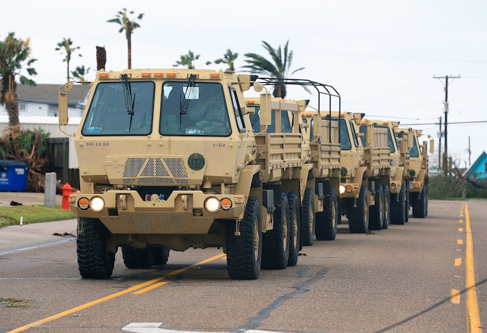 (Gabe Hernandez | Corpus Christi Caller-Times via AP) Members of the National Guard arrive at Port Aransas after Hurricane Harvey landed in the Coast Bend area on Saturday, Aug. 26, 2017, in Port Aransas, Texas. The National Hurricane Center has downgraded Harvey from a Category 1 hurricane to a tropical storm. Harvey came ashore Friday along the Texas Gulf Coast as a Category 4 storm with 130 mph winds, the most powerful hurricane to hit the U.S. in more than a decade.