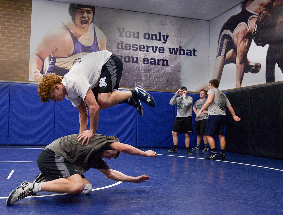 (Leah Hogsten  |  The Salt Lake Tribune)  Bingham High School wrestler Cole Moody, (leaping) Utah's reigning state champion, spars with teammate Mason Chirstiansen after school Friday, February 2, 2018.