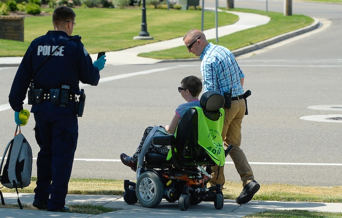 (Francisco Kjolseth  |  The Salt Lake Tribune)  Activists are removed from a building where they staged a protest against a private prison company with contracts to hold undocumented immigrants on Thursday, July 12, 2018, at the headquarters of Management and Training Corporation in Centerville.