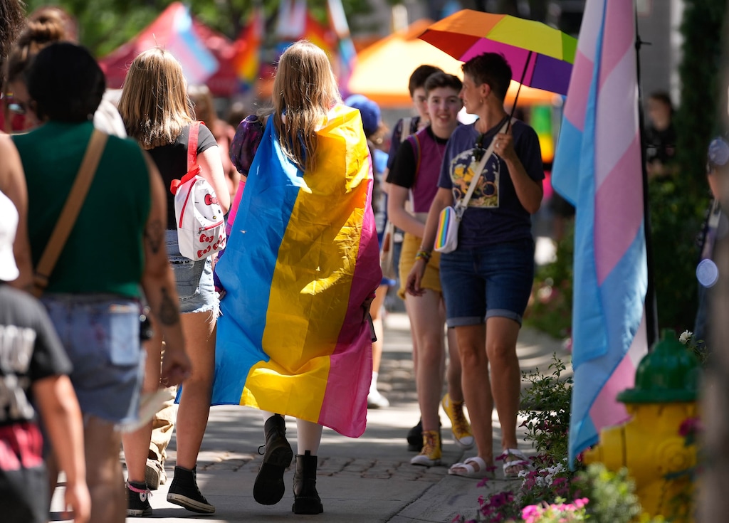 (Francisco Kjolseth  |  The Salt Lake Tribune) People stroll down Rio Grande St. during the first SLC Pride, at The Gateway in downtown Salt Lake City, on June 29, 2024.