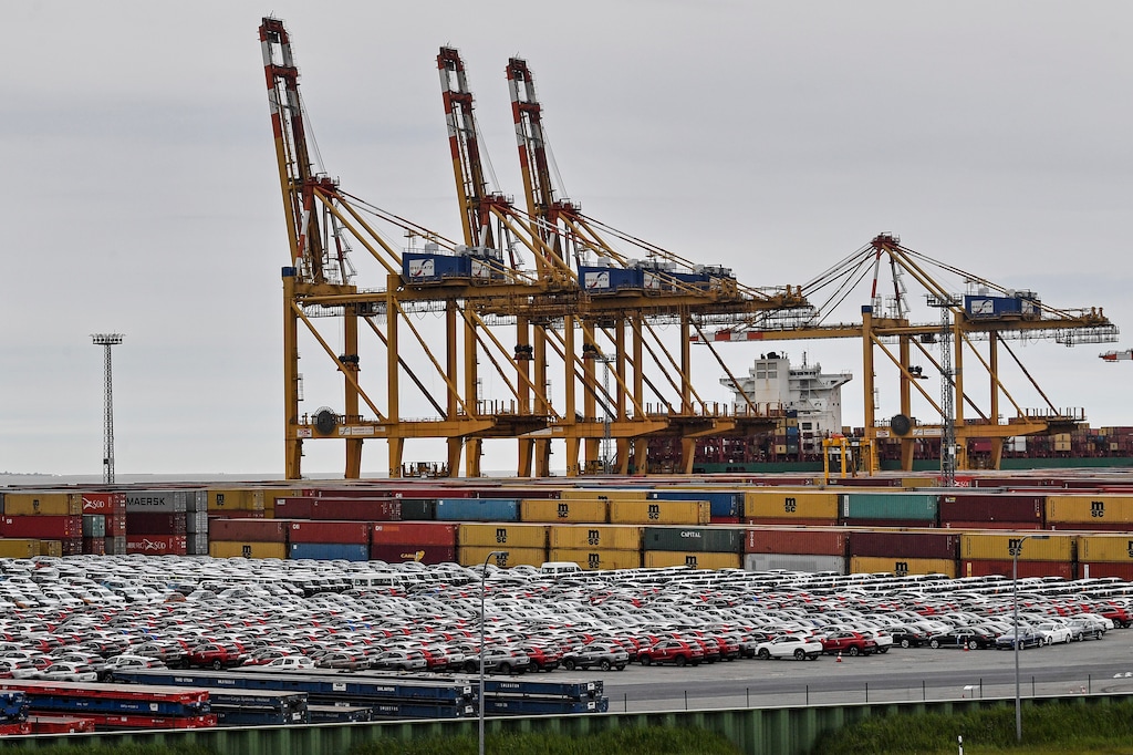 (Martin Meissner | AP) Cars for export and import are stored in front of containers on Thursday, May 16, 2019, at the harbor in Bremerhaven, Germany, with 2 million vehicles per annum one of the largest automobile hubs in the world. U.S. President Donald Trump is delaying any decision to impose tariffs on car and auto-part imports for now.