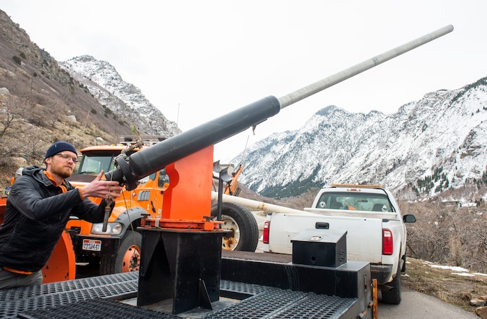 (Rick Egan | The Salt Lake Tribune) Steven Clark, Avalanche Forecaster for the Utah Department of Transportation, demonstrates how to load the Avalauncher, which uses compressed gas to fire a projectile that explodes and triggers avalanches. Tuesday, March 5, 2019.