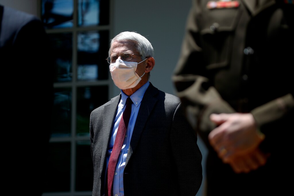 (Alex Brandon | AP file photo)  Director of the National Institute of Allergy and Infectious Diseases Dr. Anthony Fauci listens as President Donald Trump speaks about the coronavirus in the Rose Garden of the White House, Friday, May 15, 2020, in Washington.