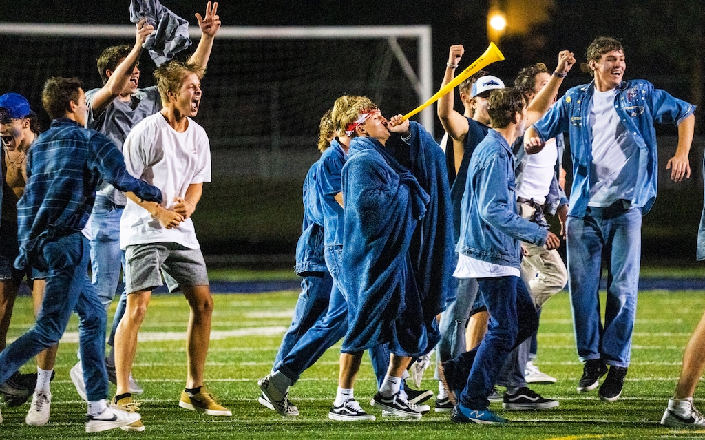 (Rick Egan | The Salt Lake Tribune)  Fans run onto the field at the buzzer, as the Corner Canyon Chargers defeated the East Leopards, on Saturday, Aug. 21, 2021.