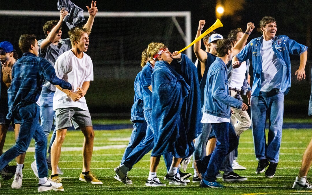(Rick Egan | The Salt Lake Tribune)  Fans run onto the field at the buzzer, as the Corner Canyon Chargers defeated the East Leopards, on Saturday, Aug. 21, 2021.