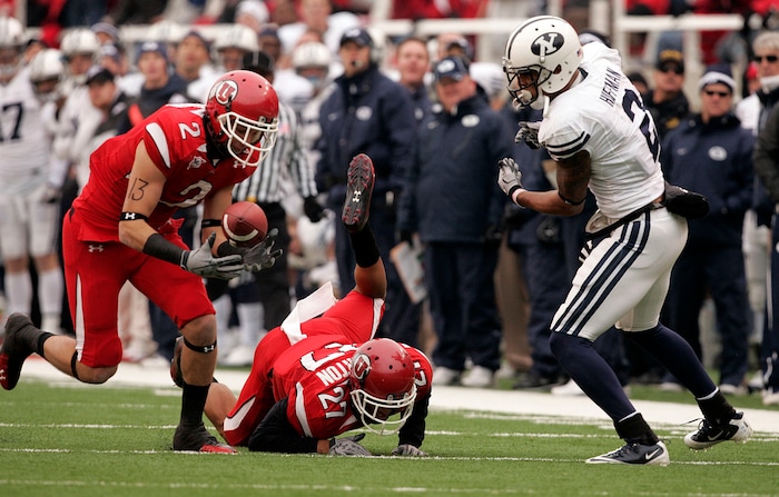 (Trent Nelson  |  Tribune file photo)  Utah Utes cornerback Brian Blechen #2 catches an interception after Utah Utes cornerback Brandon Burton #27 broke up a pass meant for BYU receiver Cody Hoffman (2) as the Utes face BYU in the second quarter at Rice-Eccles Stadium Saturday, November 27, 2010.