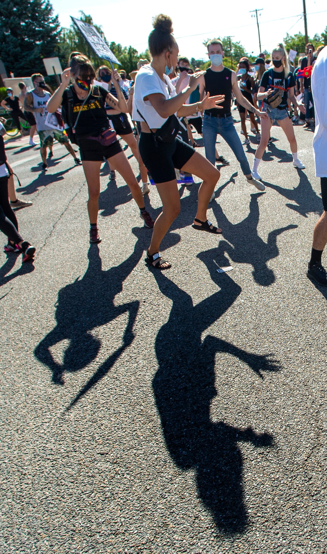 (Rick Egan  |  The Salt Lake Tribune)     Protesters dance in the street on Foothill Drive during a march for Justice onSunday, July 12, 2020.