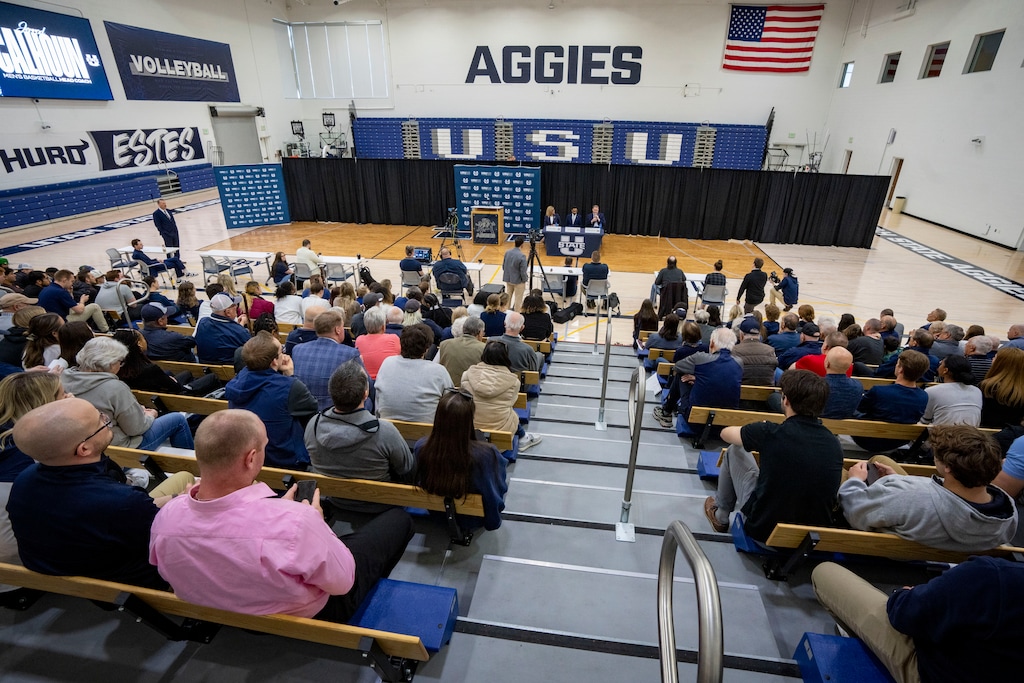 (Rick Egan | The Salt Lake Tribune) Diana Sabau, Utah State University Vice President and Athletics Director, introduces the Aggies' new women's and men's basketball head coaches, at Utah State University, in Logan, on Tuesday, April 2, 2024. Jerry Bovee has filed two lawsuits against Utah State in the wake of his July 2024 firing.