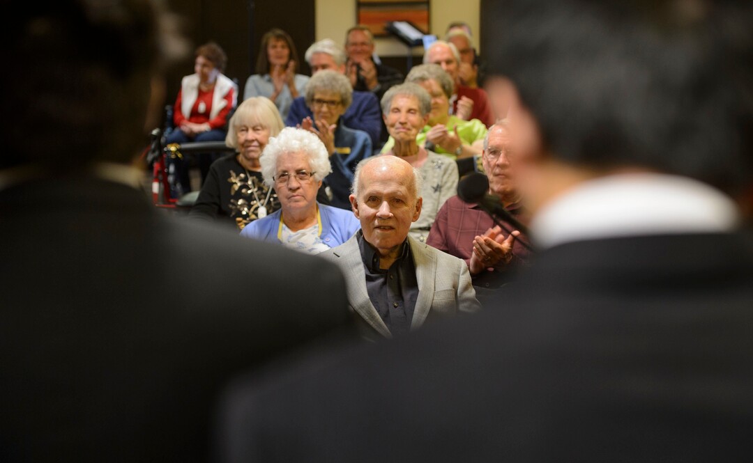 (Steve Griffin  |  The Salt Lake Tribune) Paul Christensen  listens to the Highland High School Madrigals during a Christmas concert at Cottonwood Place senior living community in Holladay Friday December 15, 2017. During the concert the Salt Lake Education Foundation presented a new scholarship in his honor. For 30 years, Christensen inspired generations of students at Highland High School to pursue their musical talents as the lively choral director of the schoolÕs many music programs.
