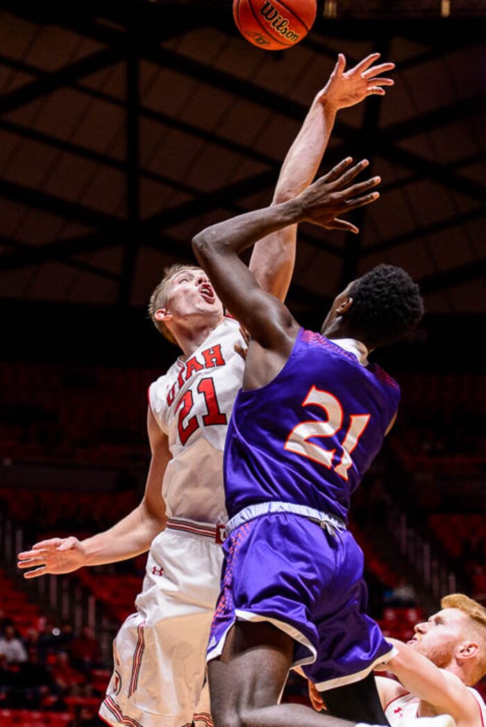 (Trent Nelson | The Salt Lake Tribune)  Utah Utes forward Tyler Rawson (21) blocks a shot by Northwestern State Demons guard Vontay Ott (21) as the University of Utah hosts Northwestern State, NCAA basketball in Salt Lake City, Wednesday December 20, 2017.