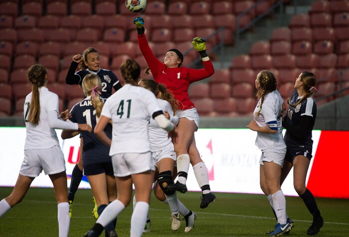 (Francisco Kjolseth  |  The Salt Lake Tribune) Olympus goalie Callie Droitsch punches a ball out of the box as they compete against Bonneville in their 5A high school girls championship game at Rio Tinto Stadium in Sandy on Friday, Oct. 23, 2020. Bonneville went on to win 1-0 in overtime.